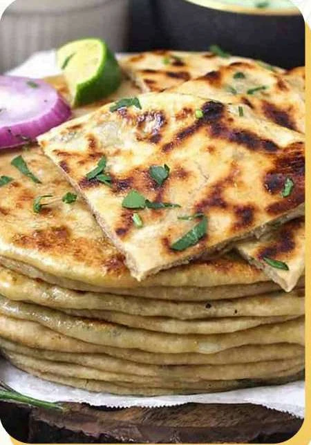 Indian parathas served with fresh onion and herbs