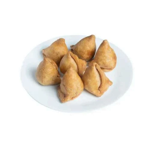 Punjabi samosas served on a white plate
